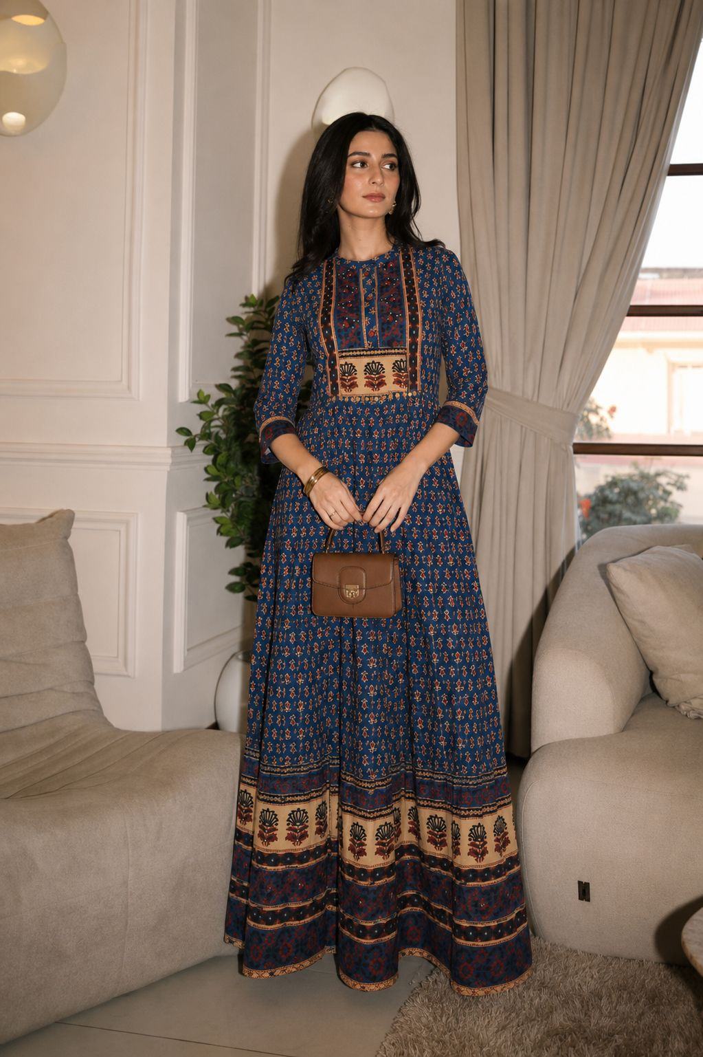 A printed indigo gown with a bordered hem